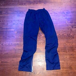 Track pants, zipper at bottom